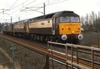 A convoy of DRS locomotives heads north at Brock on 4 January 2013. The leading two class 47s are in 'Northern Belle' livery with two class 37s in DRS livery behind. The move was from Crewe Gresty Bridge to Carlisle Kingmoor. It had been expected that a rake of coaches was to move to Carlisle as well since DRS are soon to start training runs on the Cumbrian Coast in preparation for them operating some passenger services on the line.<br><br>[John McIntyre 04/01/2013]