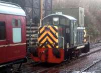 Ruston shunter D2994 - in excellent external condition - is in serious need of an umbrella at a streaming wet Bitton station on 30th December 2012. Notice the water tank on a concrete sleeper base; and the gap between engine and coach, allowing the barrow crossing to be used.<br><br>[Ken Strachan 30/12/2012]