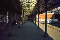 Although fading fast by the late 1970s, Felixstowe (formerly Felixstowe Town) station still possessed a measure of its former grandeur in April 1977. Fortunately, most of this architecture can still be appreciated, but in the context of a shopping centre, supermarket and car park. The trains now stop well short of the original terminus.<br><br>[Mark Dufton 09/04/1977]