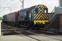 An afternoon St. Botolphs goods yard to Colchester (North) station trip working squeals round the tight curve to East Gate junction box and level crossing on 12th July 1979. <br><br>[Mark Dufton 12/07/1979]