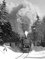 Metre gauge 2-10-2T 99 7236 has almost surmounted the climb up from Wernigerode as it approaches the level crossing near the Gasthaus <I>Drei Annen</I> with the 09.42 Wernigerode - Nordhausen (DR Harzquerbahn) in February 1987.<br><br>[Bill Jamieson 23/02/1987]