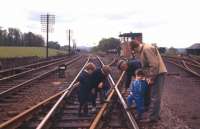 Not a sight you could see nowadays, even on a Sunday! The photographer's sons and friends are shown some detail of the trackwork at Ratho by the local PW Inspector on Sunday 30th April 1961.<br><br>[Frank Spaven Collection (Courtesy David Spaven) 30/04/1961]