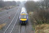 Four miles west of Grahamston station on 2 January 2013 a westbound train runs through Greenhill Lower Junction in fading light.<br><br>[John Furnevel 02/01/2013]