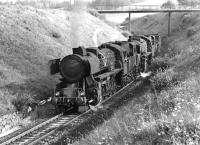 Kriegloks 52 1098 (with conventional chimney) and 52 3816 (with Giesl ejector) plod uphill not far from their destination at Summerau on a heavy mixed freight which will eventually proceed into Czechoslovakia behind CSD diesel power. The photograph, taken on 29 August 1974, is thought to show the late running 11.17 departure from Linz.<br><br>[Bill Jamieson 29/08/1974]