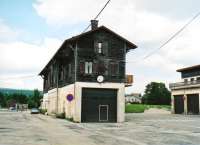 My local contact assured me that this building was formerly an engine shed; but as this railway [see image 25796 for the surviving Swiss side] was electrified from its opening in 1921, this seems unlikely - perhaps a station? The French part of this railway had a short life, being closed from 1940 to 1948 due to war, and closed totally in 1958. A 1999 proposal to re-open from Lacure to Les Rousses was rejected on cost-benefit grounds.<br><br>[Ken Strachan 13/09/2009]