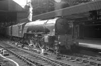 An undated photograph showing A1 Pacific no 60115 <I>Meg Merrilies</I> with a train at Newcastle Central. The locomotive spent the first 12 of its 14 operational years at Gateshead, with the last two at Leeds, Copley Hill, from where it was finally withdrawn in November 1962.  <br><br>[K A Gray //]