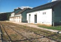 Divonne station appears in bus timetables, because buses still stop opposite the ticket office (right), which still sells rail tickets. But the tracks stop under the bushes on the left. To the right, there is a car park, which included an isolated buffer stop at this time. Across the border in Switzerland, there is a stub of this line with a small freight terminal and grain loading silo about 2km from Nyon station.<br><br>[Ken Strachan 14/09/2009]