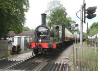 J72 no 69023 at Undercliff level crossing, Pickering, in June 2011. The 0-6-0 tank is at the rear of the <I>Yorkshire Coast Express</I>, bound for Whitby, hauled by D7628 [see image 34993]. <br><br>[John Furnevel 30/06/2011]