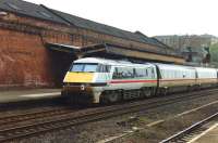 91025 is on the rear of a Kings Cross - Leeds service being diesel hauled through Wakefield Kirkgate towards Leeds in April 1992. The diesel locomotive had been attached at Wakefield Westgate, where the train had reversed.<br><br>[David Pesterfield 18/04/1992]