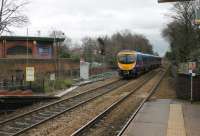 Diverted from its usual Warrington Central route by a landslip at Glazebrook, TPE 185104 speeds east through Huyton. The train has just cleared the signal that controls the junction for the St Helens and Wigan line and is heading towards Earlestown. Both these lines are to be electrified under the current programme.<br><br>[Mark Bartlett 28/12/2012]