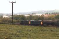 Brush Type 3s 31285 + 31264 double head a rake of fuel or bitumen bogie tanks west between Mirfield and Heaton Lodge Junction in May 1987. <br><br>[David Pesterfield 06/05/1987]