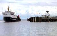 The CalMac Ferry MV <i>Saturn</i> approaching Brodick Pier, Arran, on 16 July 2011 following the crossing from Ardrossan Harbour [see image 15068].<br><br>[John Steven 16/07/2011]