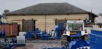 This is the former goods shed at Biggar viewed from across the field and former station site to the south in January 2013. Wooden goods sheds don't often survive. Just as well it found new uses.<br><br>[Ewan Crawford 06/01/2013]