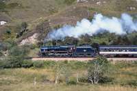 Black 5 No. 44767 makes a nice broadside shot as it works uphill from Glenfinnan in September 1993. The condensing steam suggesting that there is still a chill in the air even though it is late morning.<br>
<br><br>[Bill Jamieson 05/09/1993]