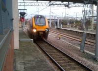 I believe they call this the built environment. Due to temporary closure of the Derby-Birmingham route [see image 41853], this Birmingham-bound Voyager has just gone the 'Great Way Round' via Leicester; and is passing through platform 6 on its way to the WCML flyover.<br><br>[Ken Strachan 03/02/2013]