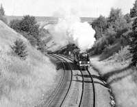 Bulleid 'Merchant Navy' Pacific no 35028 <I>Clan Line</I> just south of Pontefract Baghill station on 15 September 1979. The locomotive is on its way from York to Sheffield to pick up the Merchant Navy LPG <I>Strongbow Express</I>. The tall three arched Swanhill Lane Bridge in the photograph was later demolished due to mining subsidence and replaced with the present structure. [With thanks to Vic Smith]<br><br>[Bill Jamieson 15/09/1979]