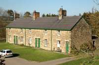 The terrace of 5 railway cottages at Whittingham in Northumberland in April 2007. Clearly built to last, as were all the buildings on the Cornhill branch. All occupied and well maintained, in uniform Brunswick Green, some 120 years after build and c 75 years after the last passengers passed through the station.<br><br>[Brian Taylor 07/04/2007]