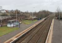 Unlike neighbouring Dalston, Wigton has lost its original station buildings and only has a small metal shelter on each platform. That said, it is in a very tidy condition. Sunday scene viewed towards Dalston and Carlisle from the station footbridge. There are just three trains each way on Sundays running only between Whitehaven and Carlisle in the afternoon and early evening. <br><br>[Mark Bartlett 03/02/2013]