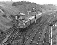 Peak No. 45017 clatters over the pointwork outside Goose Hill Junction on 17th July 1975 with the 09.00(SO) Weymouth - Leeds with a portion for Bradford via Huddersfield having been detached at Sheffield. [With thanks to Duncan Young]. <br><br>[Bill Jamieson 17/07/1975]