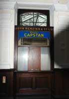 The hatch at the rear of the John Menzies kiosk which once served passengers in the booking hall at Elgin East station, seen here on 7th February 2013.<br><br>[Brian Taylor 07/02/2013]