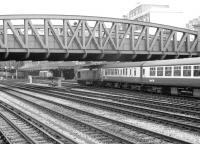 A class 50 about to enter Paddington station with a South Wales train in 1979. In the background a class 31 stands alongside the platform of Paddington parcels depot with vans being loaded beyond. [See image 42682]<br><br>[John Furnevel 14/09/1979]