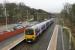 323223 heads east from Broadbottom towards Dinting on a Glossop and Hadfield service. The EMU is just about to pass the old goods shed, now in commercial use, and just beyond that will cross the tall viaduct over the River Etherow. <br><br>[Mark Bartlett 28/12/2012]