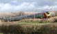 A northbound Voyager catches the sun as it passes through southern Cumbria, close to the former station at Burton and Holme, on 18 February 2012. [See image 22857]<br><br>[John McIntyre 18/02/2012]