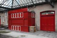 The former John Menzies kiosk on the platform at Elgin East sports a fresh coat of paint on 7 February 2013, more than 45 years after selling its last packet of 'Capstan' [see image 41995]. <br><br>[Brian Taylor 07/02/2013]