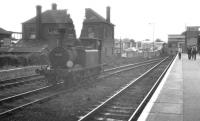 A sedate scene at Havant station, Hampshire, on an August afternoon in 1961. On the left is 0-6-0T 'Terrier' no 32650 having just taken on water at the end of the bay platform and now in the process of running round the Hayling Island branch train.<br><br>[K A Gray 13/08/1961]