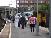 150257 runs into the down side east end bay 1A at Bridgend on 7 June 2012 with the 15.38 service from Merthyr Tydfil. The train has a large crowd waiting to join it as the soon-to-depart 17.42 service to Aberdare. <br><br>[David Pesterfield 07/06/2012]