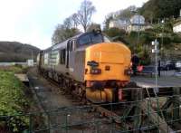 37218 ruminates on the indignity of carrying a garden gnome, rather than a pixie, after bringing the Pathfinder Tours <i>Hullaba-looe</i> to the end of the line. Sister loco' 37609 had to be left behind at Moorswater to allow passenger egress onto the rather short platform. The hot pasty van arranged by Pathfinder to provide local flavour - literally - is out of shot to the right.<br><br>[Ken Strachan 10/02/2013]