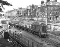 The mid '70s still saw significant numbers of loco hauled trains arriving at Scarborough during the summer season and a station pilot was indispensable. 08170 propels a mixed rake of Mk 1 and Mk 2 coaches back into the station late on a Sunday afternoon in July 1976.<br><br>[Bill Jamieson 04/07/1976]