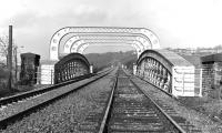 Looking north-west from about midway along the Crigglestone Junction to Horbury & Ossett chord line in 1977, with the substantial truss bridge over the Calder & Hebble Navigation dominating the foreground. In the distance there is a distinct hump where the line crosses over the River Calder itself.<br><br>[Bill Jamieson 30/01/1977]