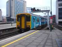 150213 in latest Arriva Trains Wales livery, as applied to its refurbished 158 DMUs, exits the east end of platform 6 at Cardiff Central as it heads for Merthyr Tydfil. <br><br>[David Pesterfield 11/02/2013]