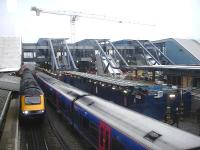 The new west end footbridge and access links to platforms 10-15 at Reading Station under construction on 12 February 2013. A First Great Western HST is about to leave platform 9 bound for Paddington, as a class 165/166 DMU arrives at platform 10.<br><br>[David Pesterfield 12/02/2013]
