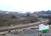 An Arriva Trains Wales 150 DMU runs back down the short Barry Island branch in February 2013 before rounding the curve to rejoin the main line at Barry station. The single line seen to left of the unit is the high level line of the Barry Tourist Railway that runs alongside the former Barry steam shed, and then alongside the main line to a platform between Barry Town and Barry Docks Stations.<br><br>[David Pesterfield 11/02/2013]