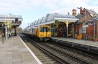 Restored glass and wrought iron canopies are still in place at Birkdale, a suburb of Southport, and are seen to good effect on 15 February 2013 as 507009 calls on a Southport to Hunts Cross service. <br><br>[Mark Bartlett 15/02/2013]