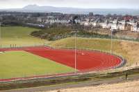 Looking west from the top of the artificial ski slope at Meadowmill Sports Centre over Prestonpans towards Edinburgh in February 2013. The site was previously a mining area and a rail-served washery survived until around 1970. A class 380 passes the former rail connection on the ECML.<br><br>[Bill Roberton 17/02/2013]