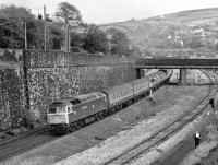 47555 <I>The Commonwealth Spirit</I> is dwarfed by the retaining wall west of Marsden station as it passes with a westbound Trans-Pennine express for Liverpool Lime Street in October 1982. The spectators are awaiting the imminent arrival of preserved A4 <I>Sir Nigel Gresley</I> with 'The Pennine Pullman' [see image 34607]. <br>
<br><br>[Bill Jamieson 09/10/1982]