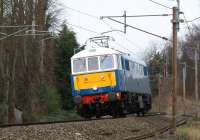 Having hauled the first leg of the Winter CME2 from London to Carnforth on 16 February 2013, E3137 (86259) <I>Les Ross</I> is seen just south of Lancaster heading light engine to Preston. The loco stabled there before collecting the return leg of the tour at Farington Junction.<br><br>[John McIntyre 16/02/2013]