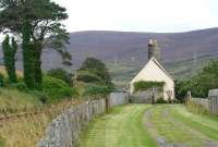 Approach to the closed station at Loth, Sutherland, in the summer of 2007. View is south west towards Brora with the Far North line running past on the left and the A9 off picture to the right. Loth station closed to passengers in June 1960.<br><br>[John Furnevel 27/08/2007]