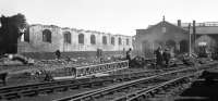 The remains of the straight shed at 52D Tweedmouth during demolition on 4th May 1968. The roundhouse in the right background still survives in 2013, albeit now derelict following a fire some years ago. [See image 40716]<br><br>[Bill Jamieson 04/05/1968]