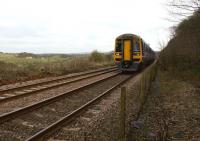 158817 climbs Hoghton bank on 16 February 2013 with a York to Blackpool service. To the right there used to be a quarry siding, controlled by a signalbox to the left. The remains of the brick base of the box can still be seen.<br><br>[John McIntyre 16/02/2013]