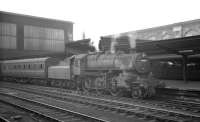 One of Kingmoor shed's Ivatt 2-6-0s, no 43011, simmers alongside Carlisle platform 4 on a fine summer evening in August 1963 awaiting its departure time with the 7.5pm stopping train to Appleby West.<br><br>[K A Gray 03/08/1963]