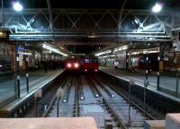 All platforms are occupied at Hammersmith on 5 February 2013, with three trains of old stock standing side by side at the western terminus of the Hammersmith and City line.<br><br>[Ken Strachan 05/02/2013]