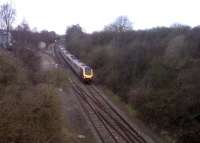 View south at Melbourne Junction in February 2013, with the Voyager just over a mile short of Derby station. The tracks to the left used to run to Ashby-de-la-Zouch; and are still used to deliver jet fuel to the Rolls-Royce engine test beds. The vestigial passenger service to the Sinfin stations - which was met by RR security staff to let workers through the otherwise locked gates in the factory fences - finished about 20 years ago.<br><br>[Ken Strachan 21/02/2013]