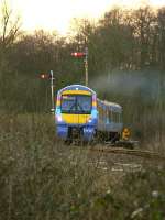 A class 170 DMU storming up the bank from Brundall, Norfolk, bound for Great Yarmouth, in February 2006.<br><br>[Ian Dinmore /02/2006]