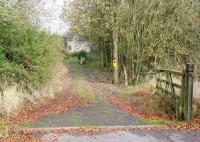 The driveway leading to the remote former station at Penton, Cumbria, in November 2007. Opened in March 1862 between Riddings Junction and Kershopefoot it served no community of any size, taking its name from nearby Penton House. Scene of <I>the great Penton tomato rescue</I> [see image 17983] the station closed with the rest of the Waverley route in January 1969 and is now a private residence. <br><br>[John Furnevel 03/11/2007]