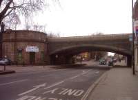 The two shallow arch viaducts built to carry four tracks of the GNR towards Nottingham are still elegant in 2013, but look a bit unfocussed; as they are covered in netting to stop bits of iron falling onto the street (Friargate) below. View looks north west away from the town centre towards Ashbourne.<br><br>[Ken Strachan 21/02/2013]