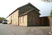 Another stone built former goods shed which has found a new use stands alongside Busby station on the East Kilbride line. This one, photographed in May 2007, forms  part of a garden equipment business. The platforms are behind the fence on the right. <br><br>[John Furnevel 06/05/2007]